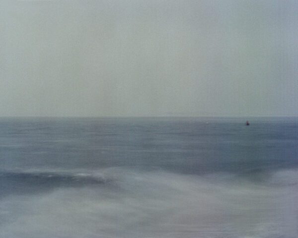 An abstract photo of a buoy in the waves